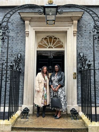 Nicola and Patricia Johnson outside the door of 10 Downing Street
